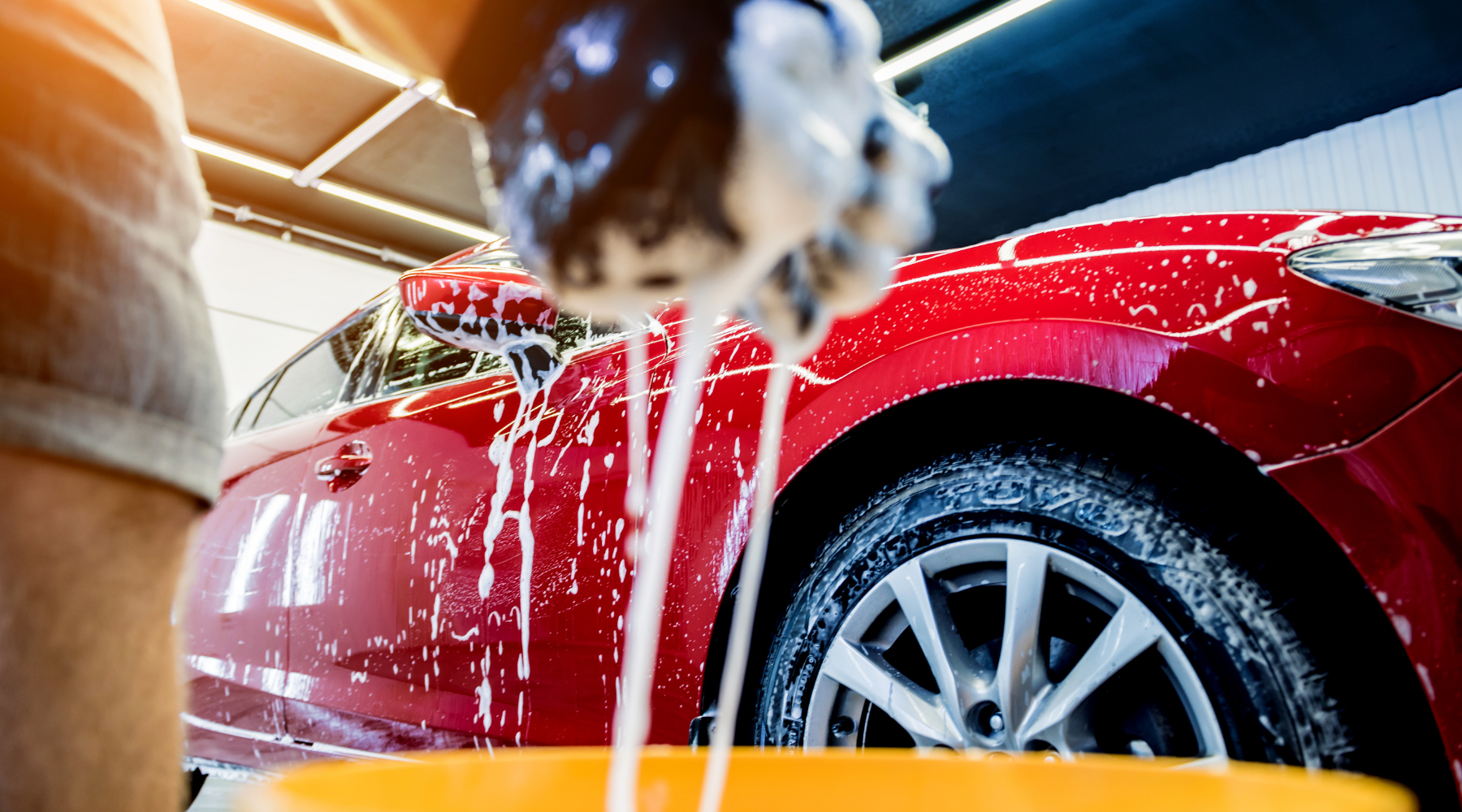 washing a red wrapped vehicle