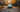 white range rover surrounded by orange fall leaves