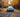 white range rover surrounded by orange fall leaves