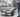 Man cleaning a car with a pressure washer