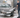 Man cleaning a car with a pressure washer