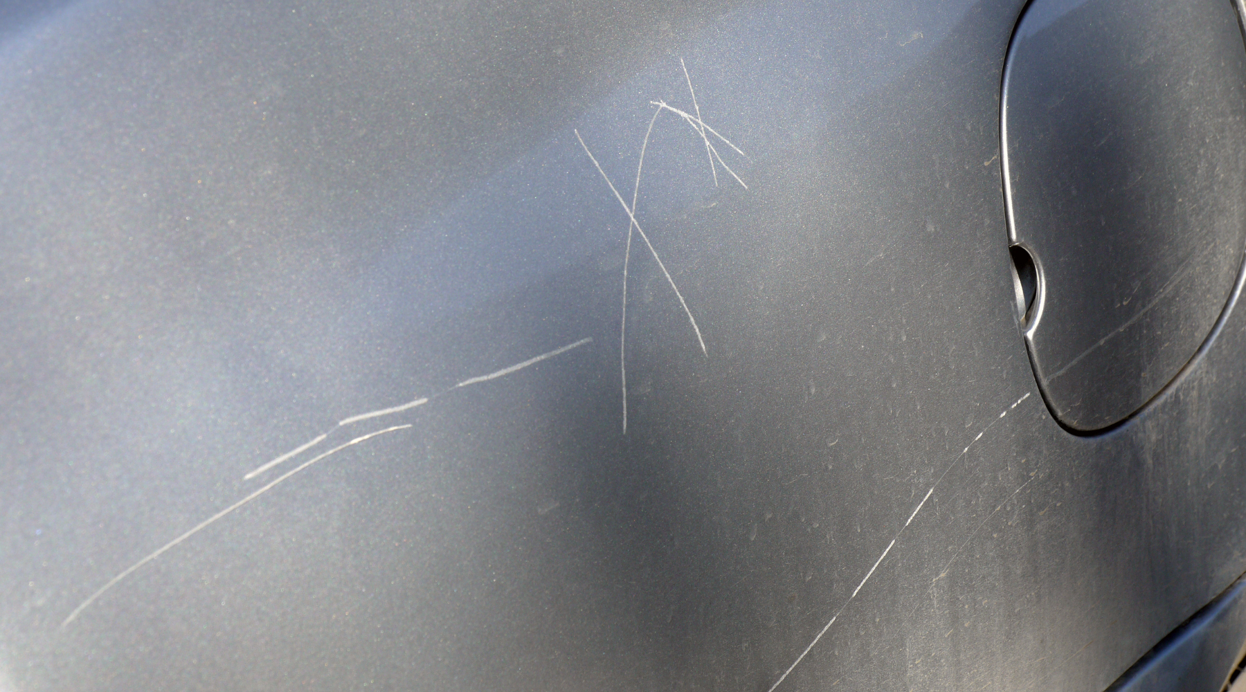scratches on a car caused by a key