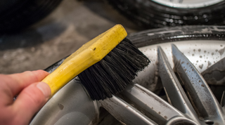 Professional cleaning brake dust from car rim
