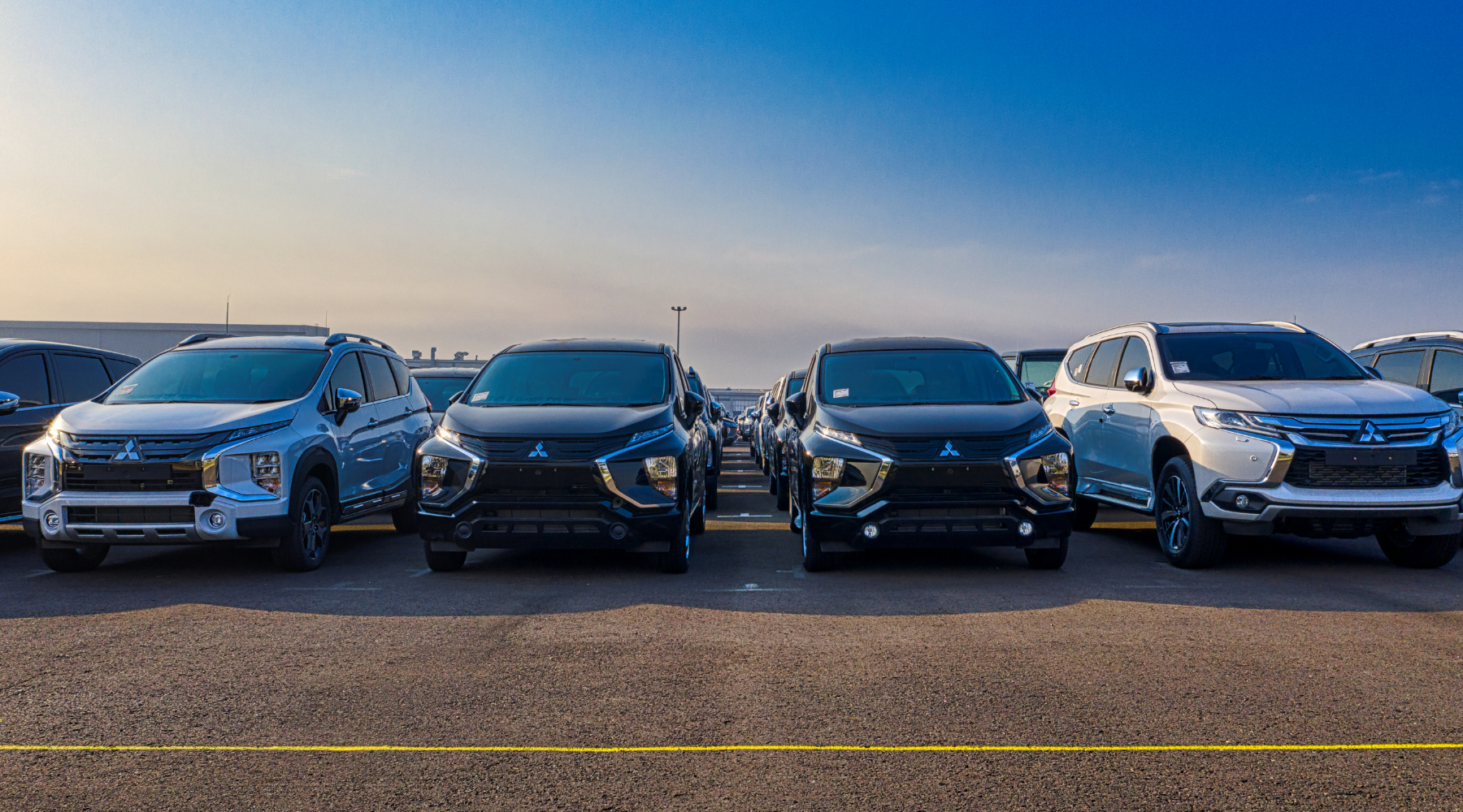 Four new vehicles lined up on a lot