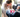parents strapping child into a clean car seat