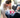 parents strapping child into a clean car seat